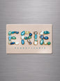 A magnet with beautiful beach glass artwork