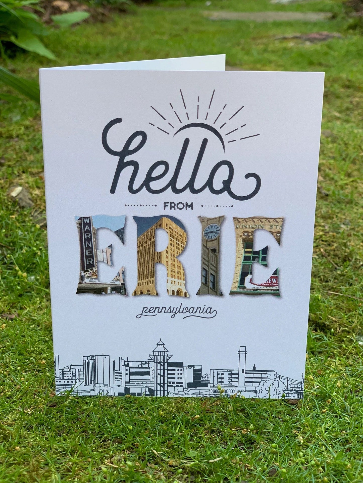Greeting card with a big spelled out hello encasing Erie landmarks