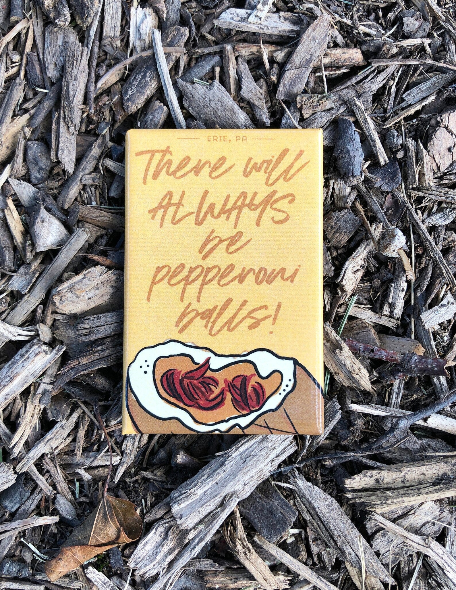 An illustrated pepperoni ball magnet