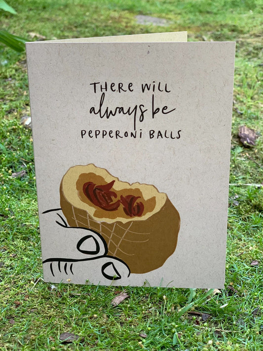 Greeting card with a playful pepperoni ball design
