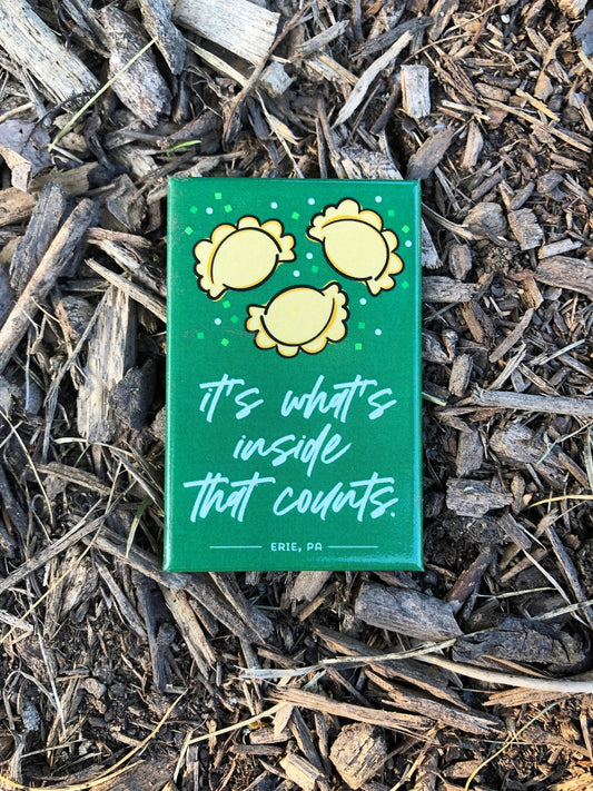 A colorful magnet with a fun pierogi design