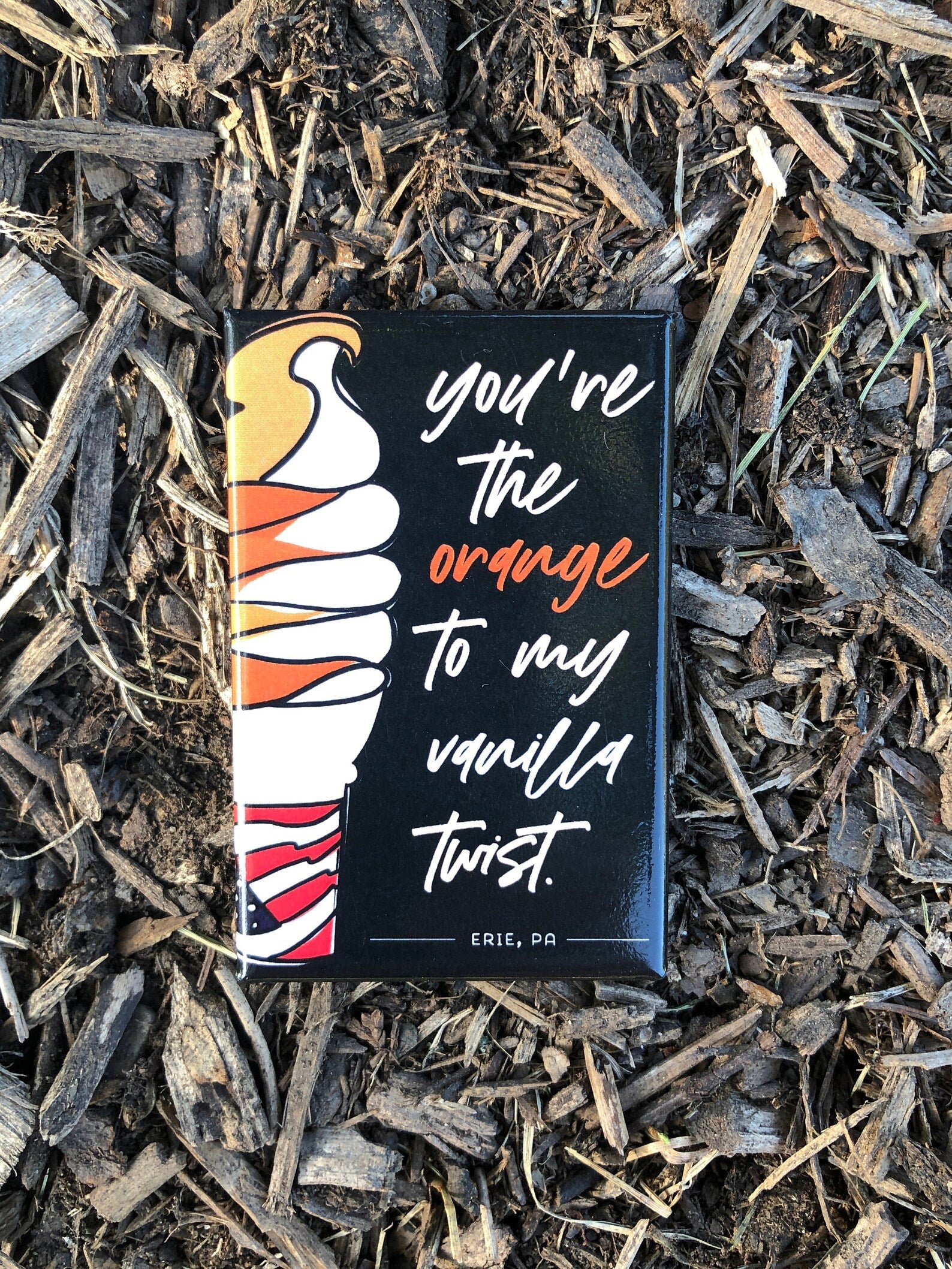 A colorful magnet of a twist ice cream cone